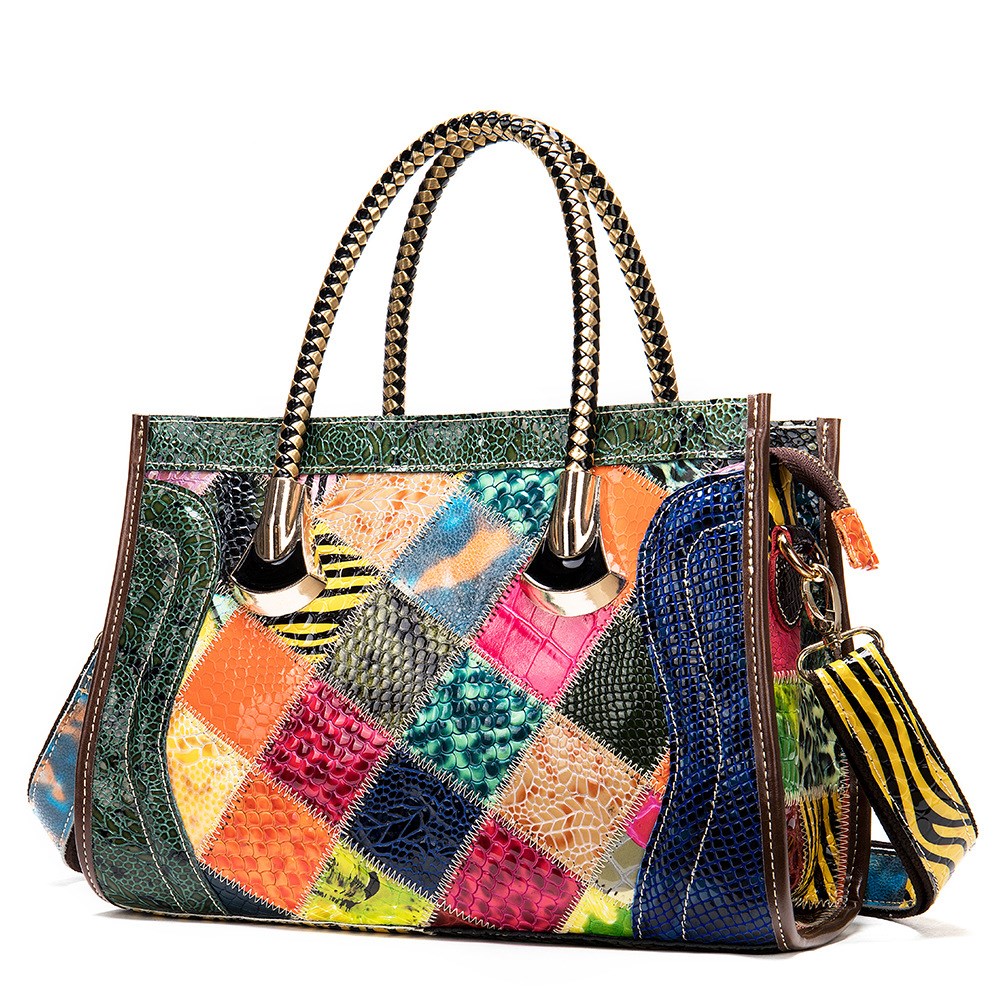 Multicolored patchwork handbag with a matching wallet on a white background