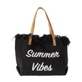 Black tote bag with 'Summer Vibes' text and fringes on a white background