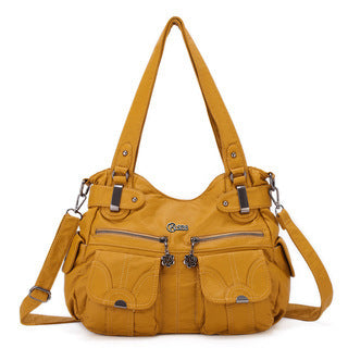 Yellow handbag with multiple pockets and zippers on a white background