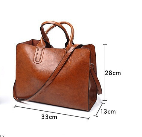 Brown handbag with measurements on a white background