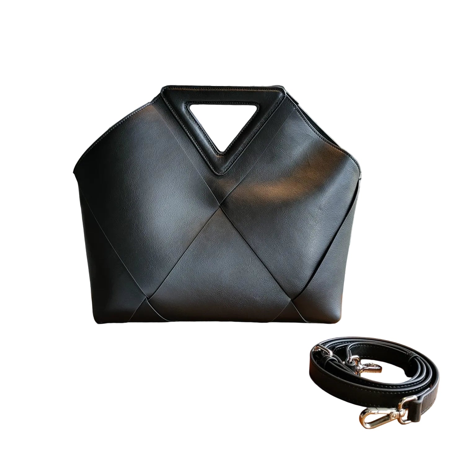 Black handbag with geometric design in a white background