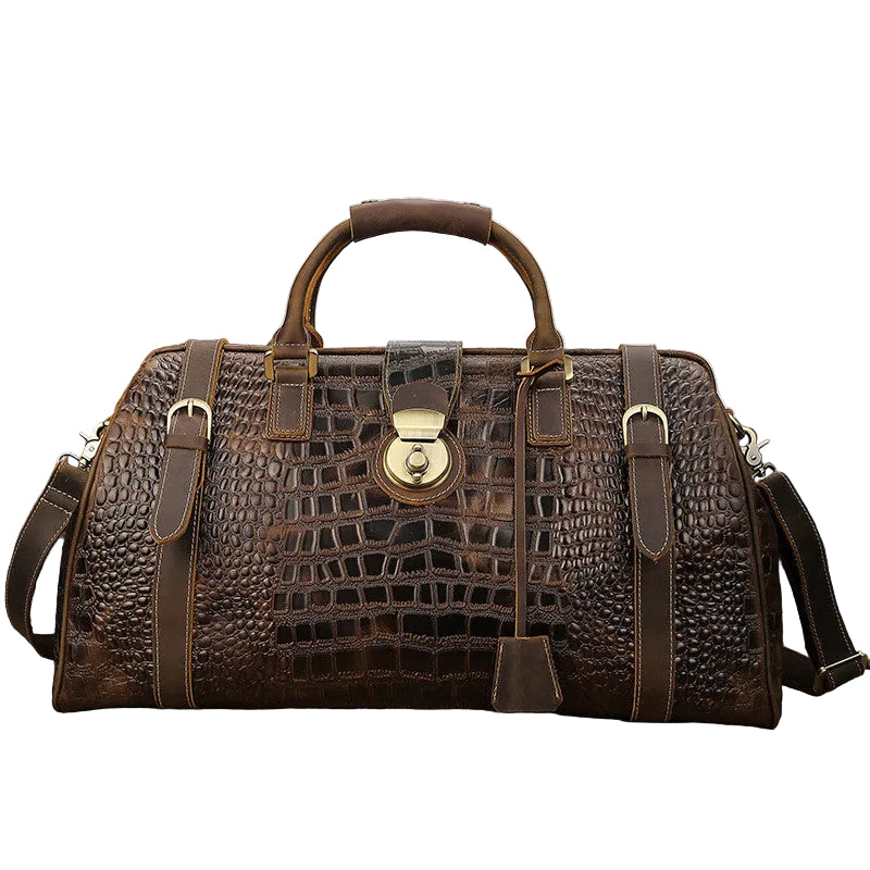 Brown leather bag with crocodile texture on a  white background.