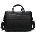 Black leather briefcase with shoulder strap on a white background
