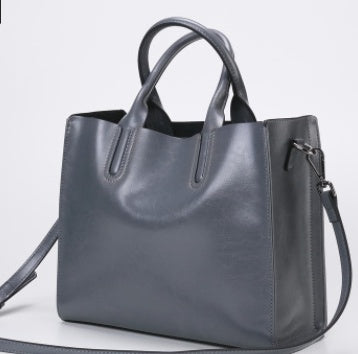 Gray handbag on a light gray background