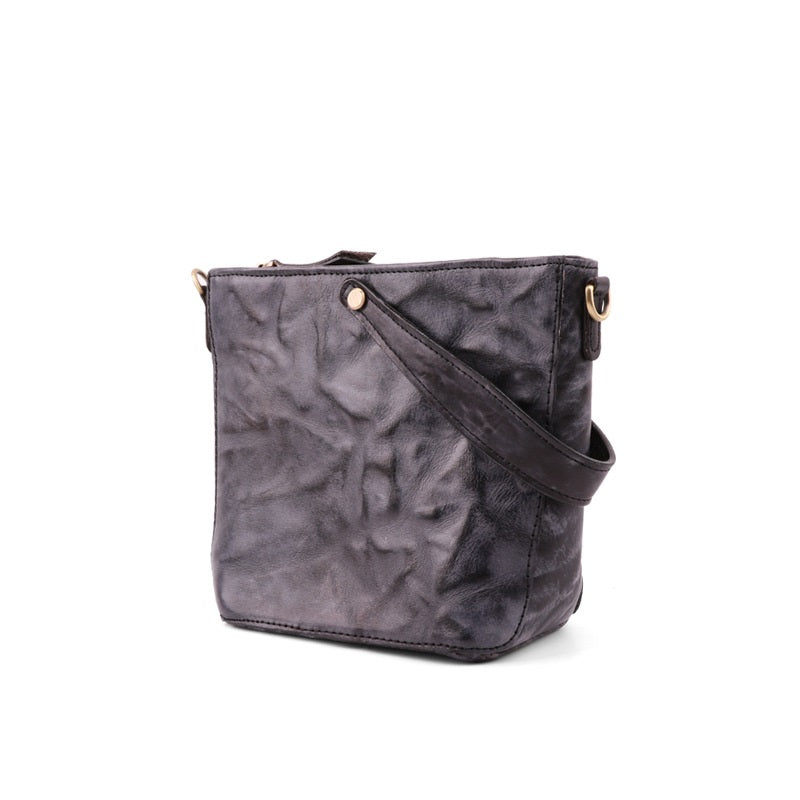 Gray textured crossbody bag on a white background