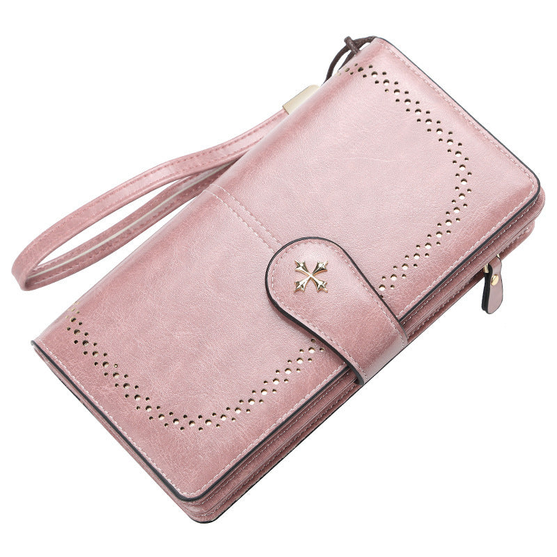 Pink wallet with a strap on a white background