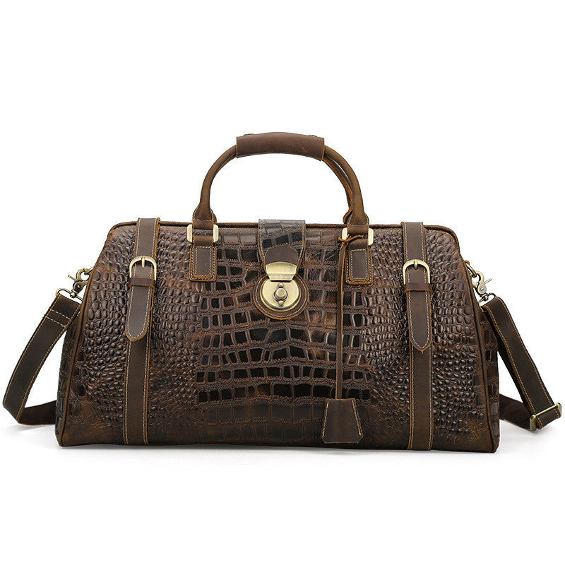 Brown textured handbag with gold accents on a white background
