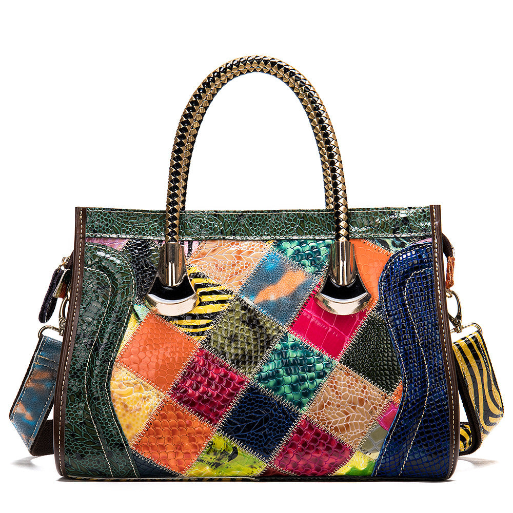 Multicolored patchwork handbag with a textured handle on a white background