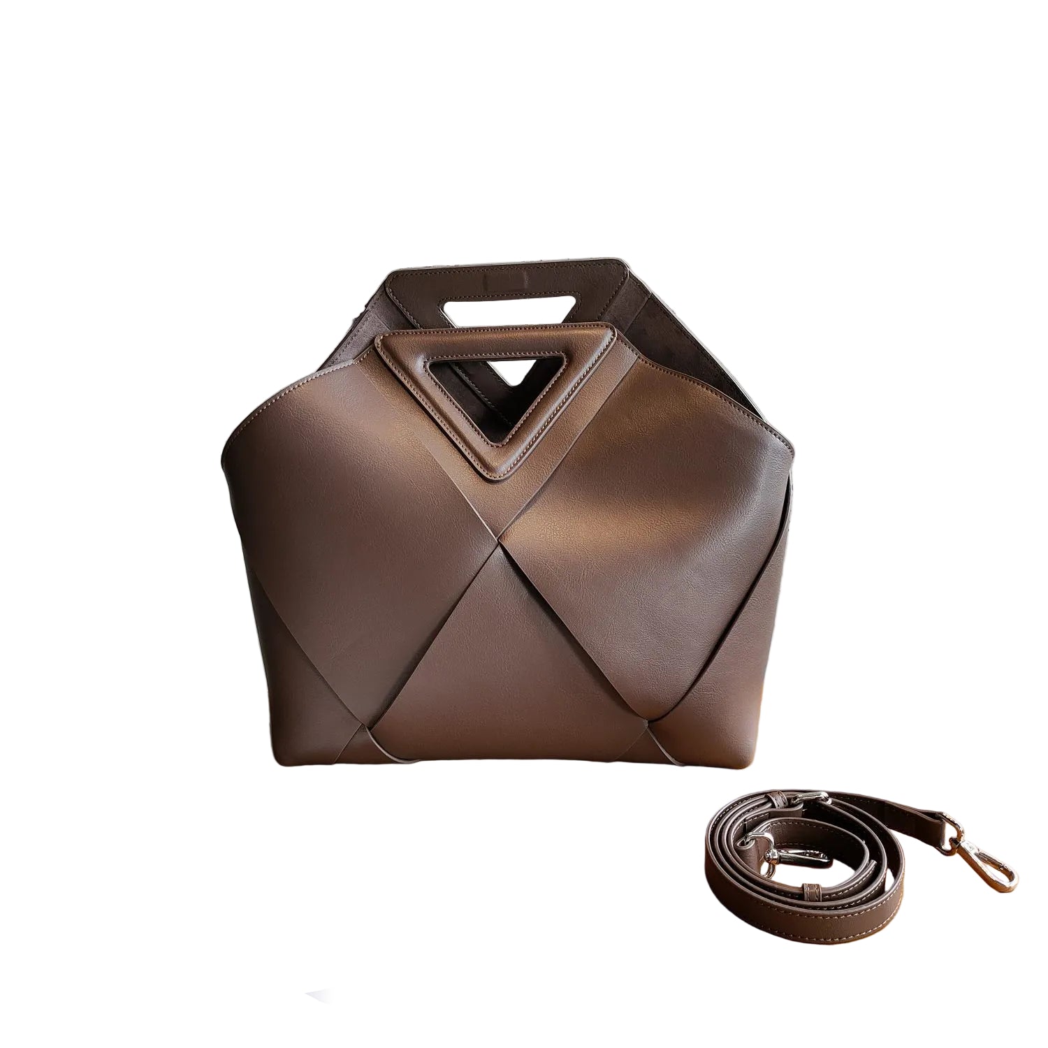 Brown leather handbag with geometric design on a white background