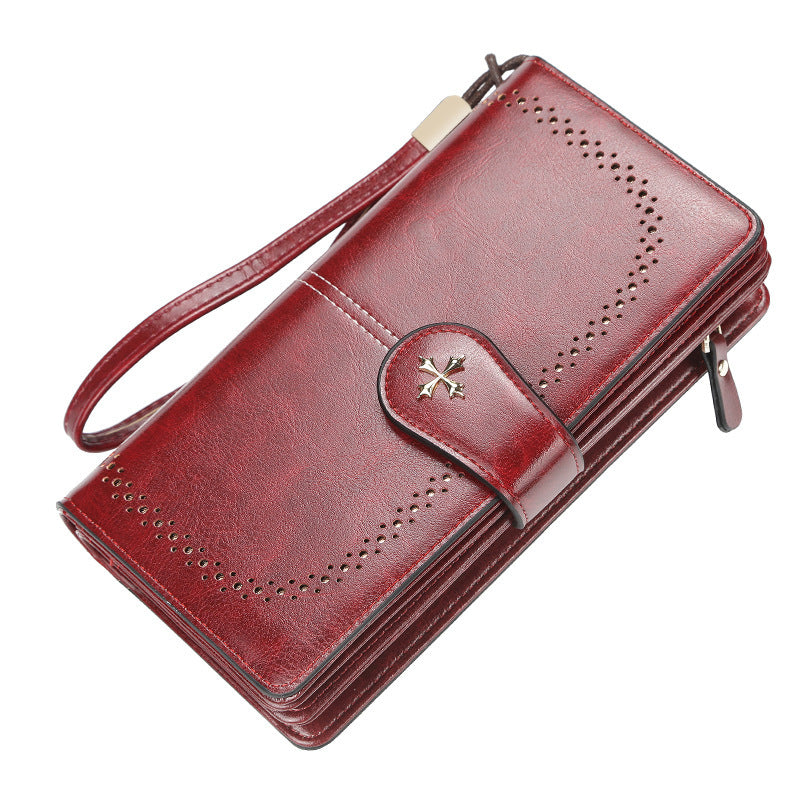Red wallet with a strap on a white background