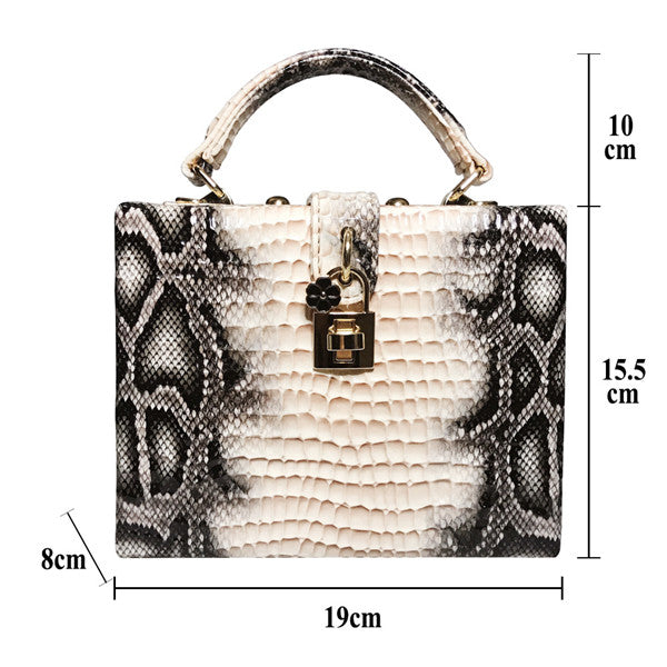 Snakeskin-patterned handbag with dimensions labeled on a white background