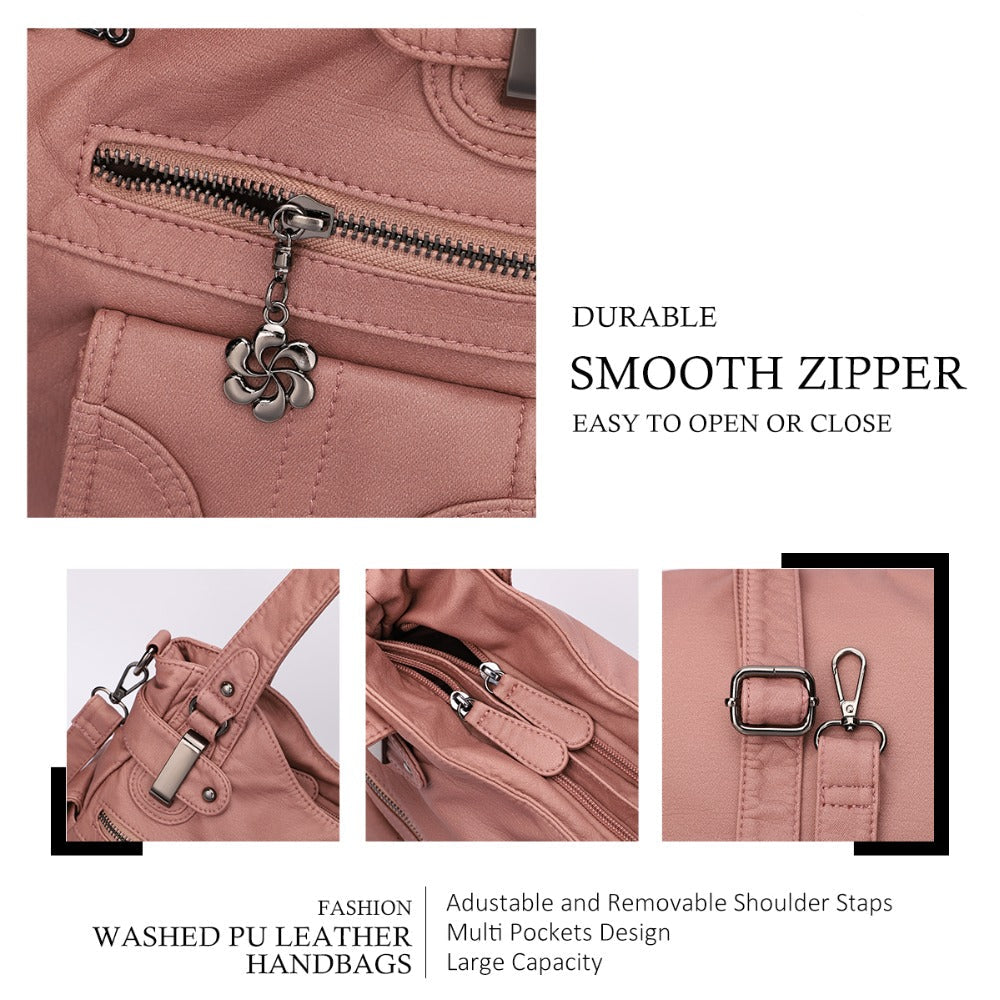 Pink handbag with zipper details on a white background