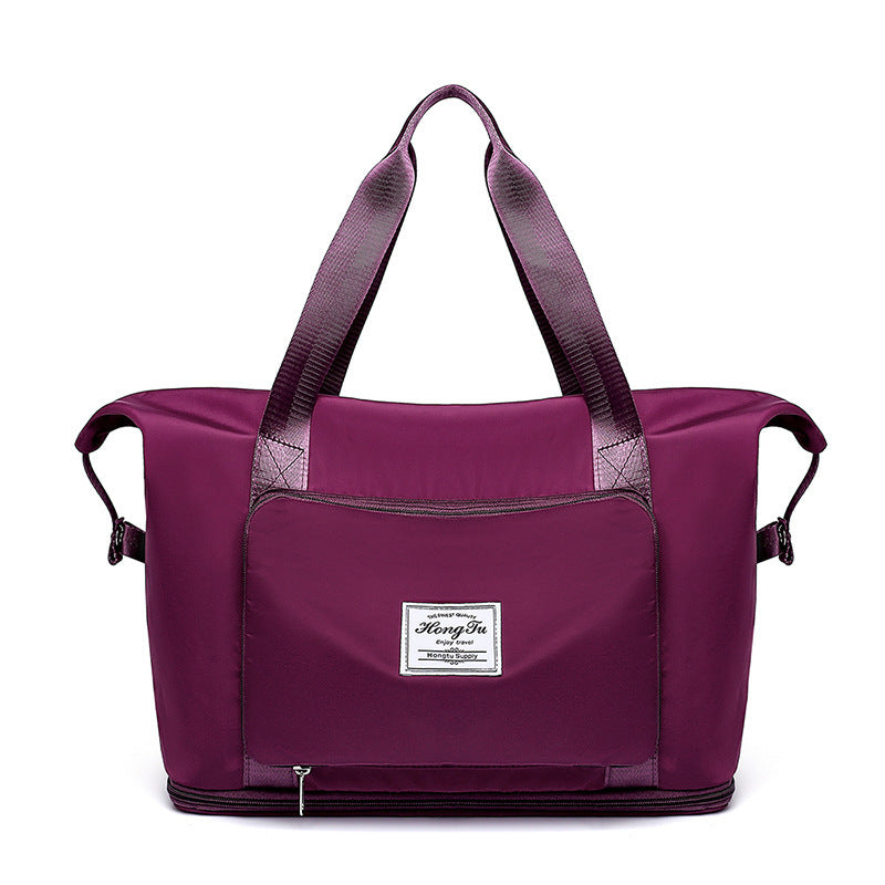 Purple travel bag with a visible brand label on a white background