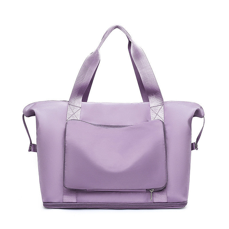Purple tote bag with a shoulder strap on a white background