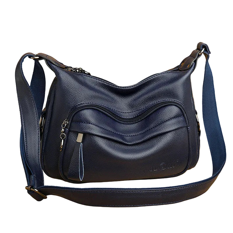 Blue leather handbag on a white background