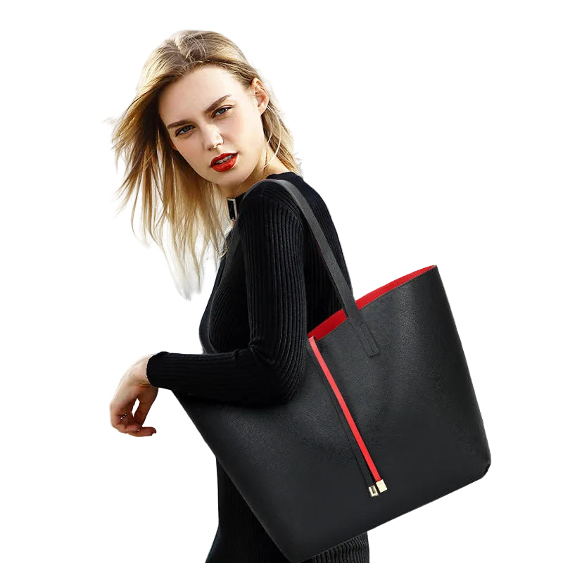 Woman holding a black tote bag on a white background