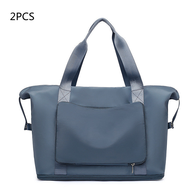 Blue tote bag with a flap closure on a white background