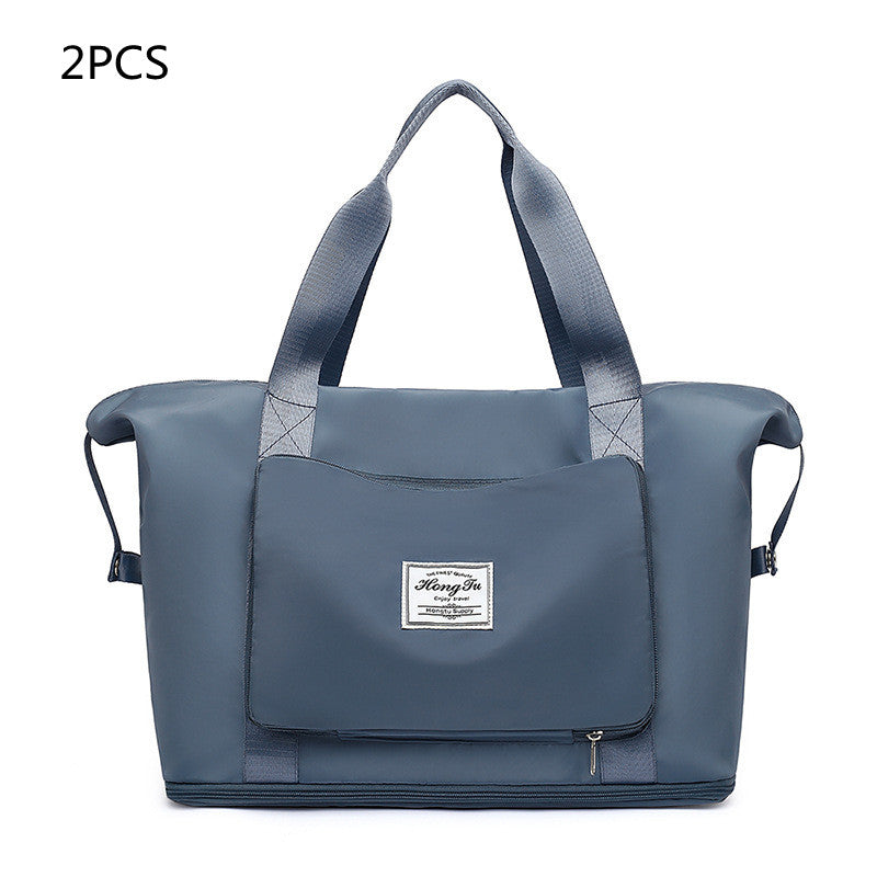 Blue tote bag with a visible brand label on a white background