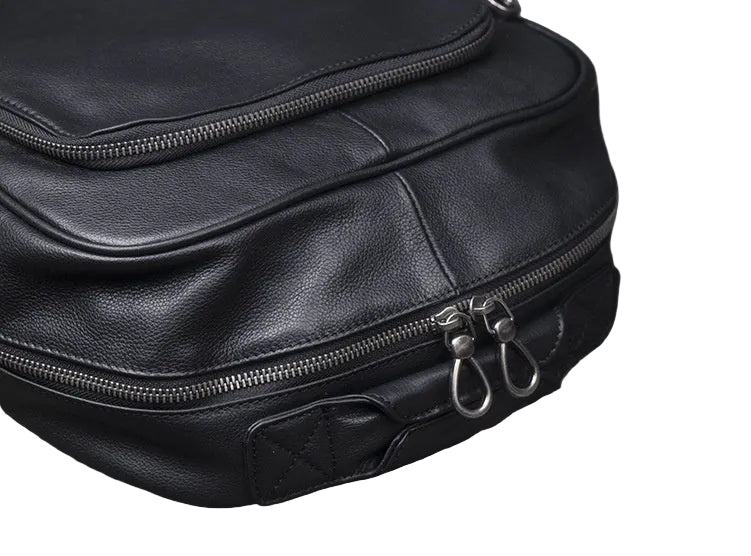 Black leather bag with zipper on a white background