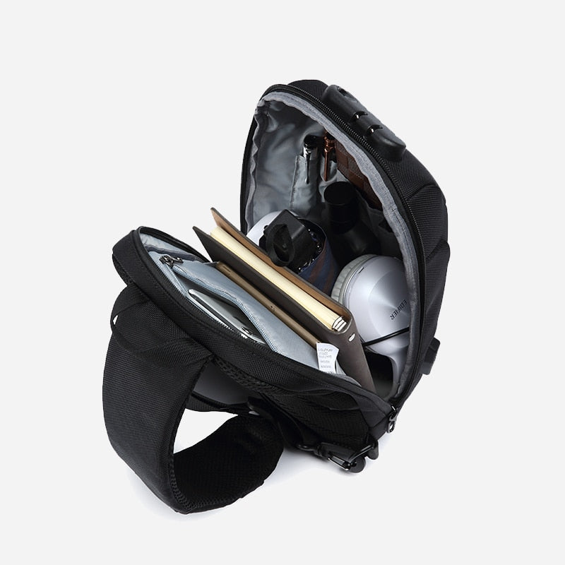 Black backpack with interior compartments on a white background