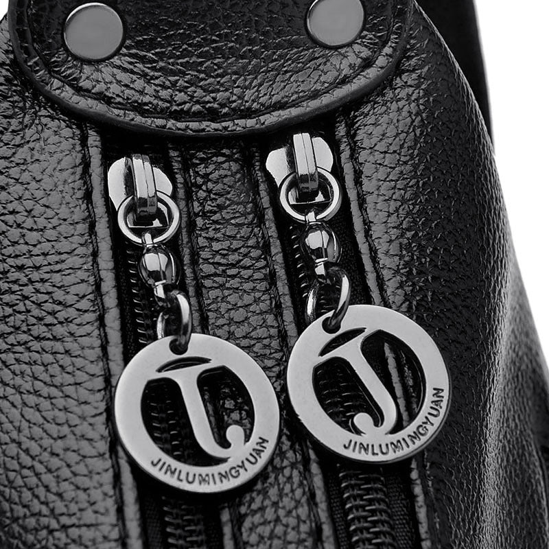 Close-up of a black leather bag on a white background