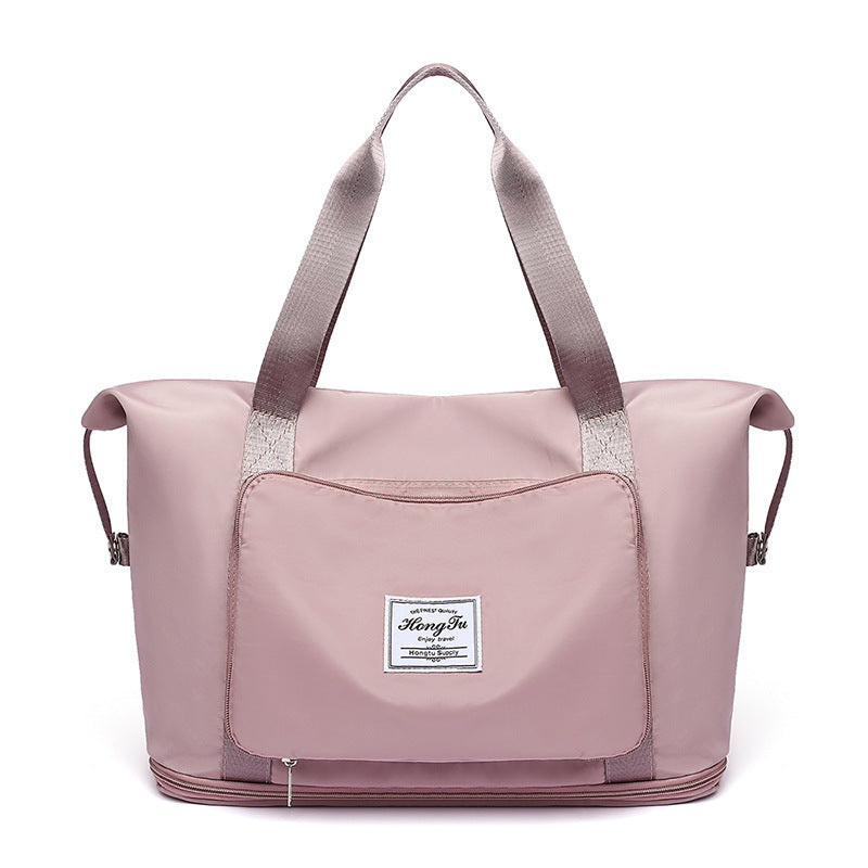 Pink tote bag with a visible brand label on a white background