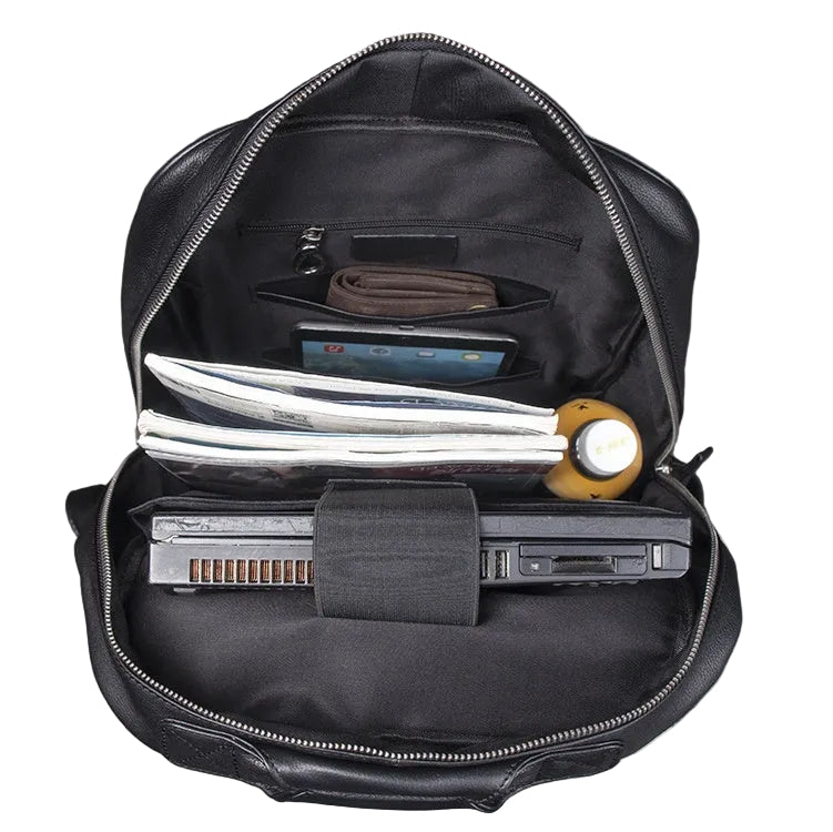 Black backpack with compartments containing electronic devices on a white background