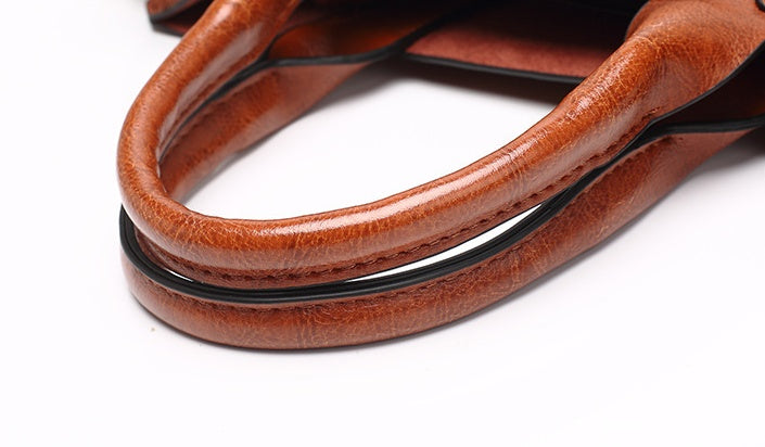 Close-up of brown leather shoelace on a white background