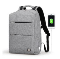 Gray backpack with USB charging port on a white background