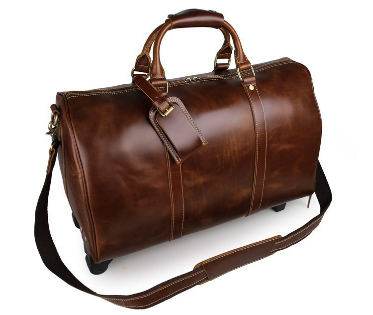 Brown leather duffel bag with wheels on a white background