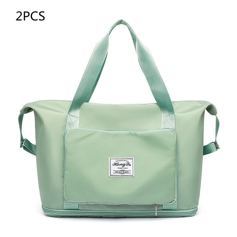 Light green travel bag with a visible brand label on a white background