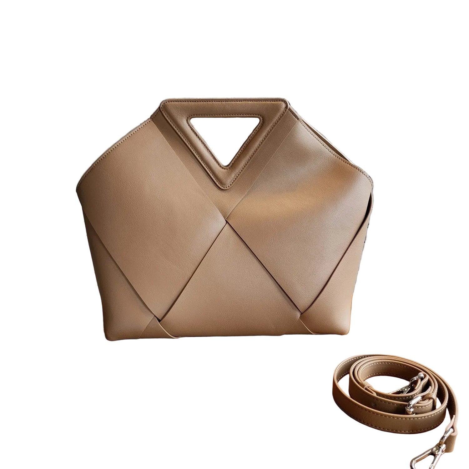 Beige handbag with geometric design on a wooden on  a white background