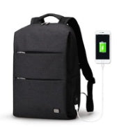 Black backpack with USB charging port on a white background