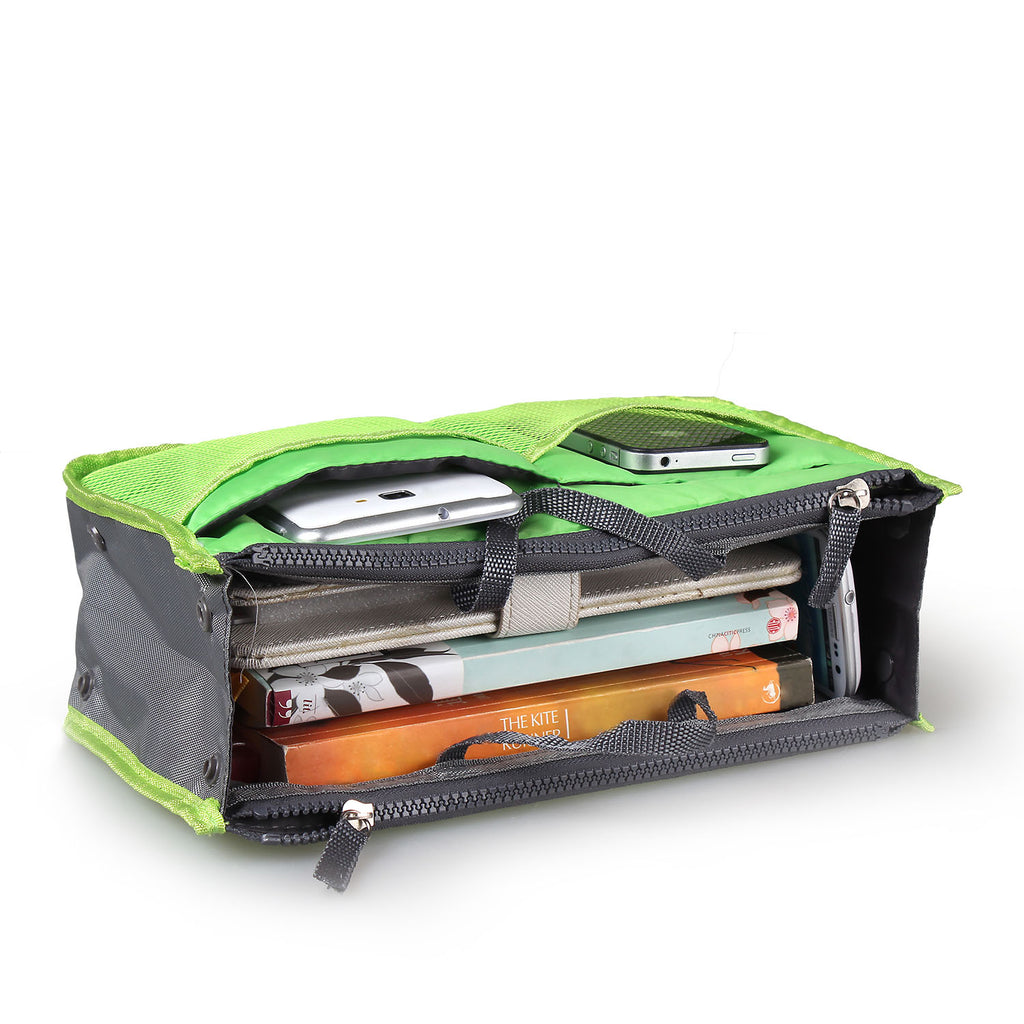 Green and gray compartmentalized bag with electronic devices inside on a white background