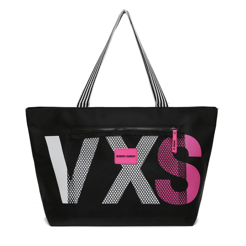 Black tote bag with 'VXS' branding on a white background