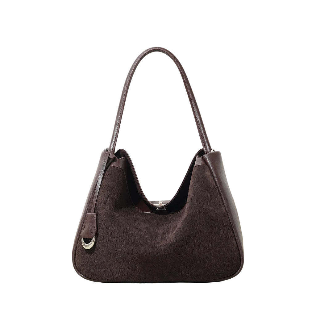 Brown handbag on a light background
