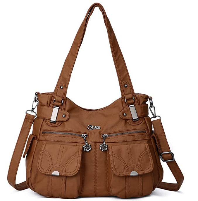 Brown handbag with multiple pockets and straps on a white background