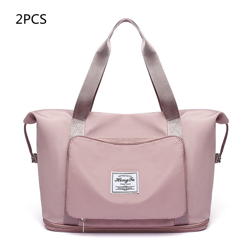 Pink tote bag with a visible brand label on a white background