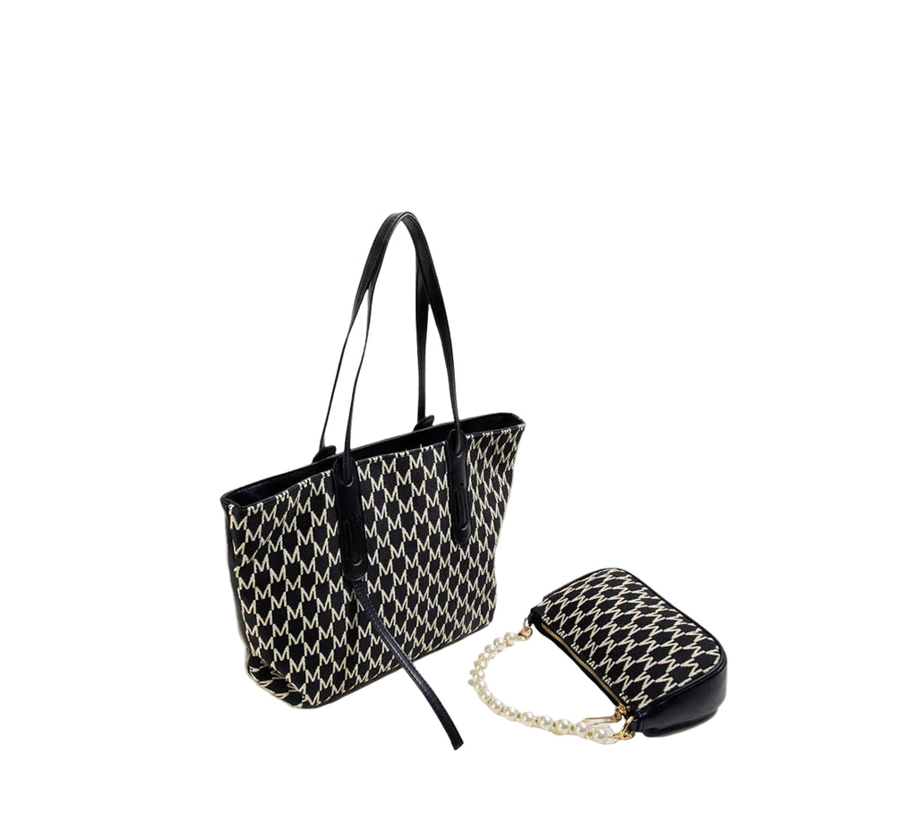 Black and white patterned handbag with a matching pouch on white  background