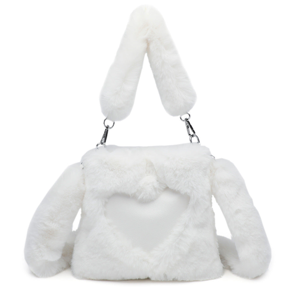 White fur handbag with bunny ears on a white background