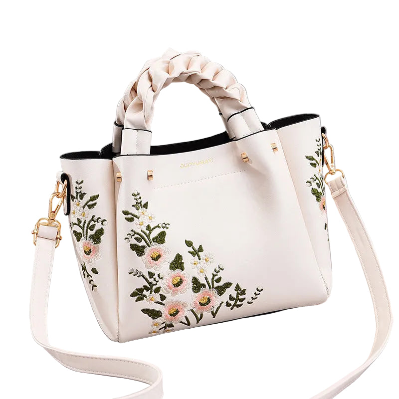 White handbag with floral embroidery on a White background