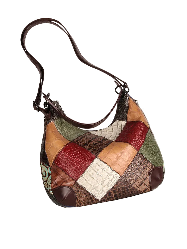 Patchwork handbag on a gray surface with a neutral background
