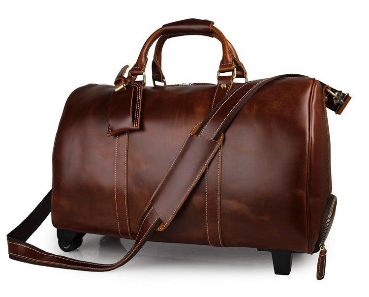 Brown leather duffel bag with wheels on a white background