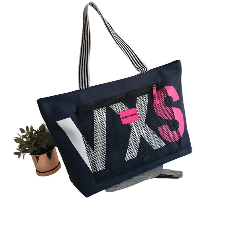 Navy blue tote bag with pink and white text on a white background