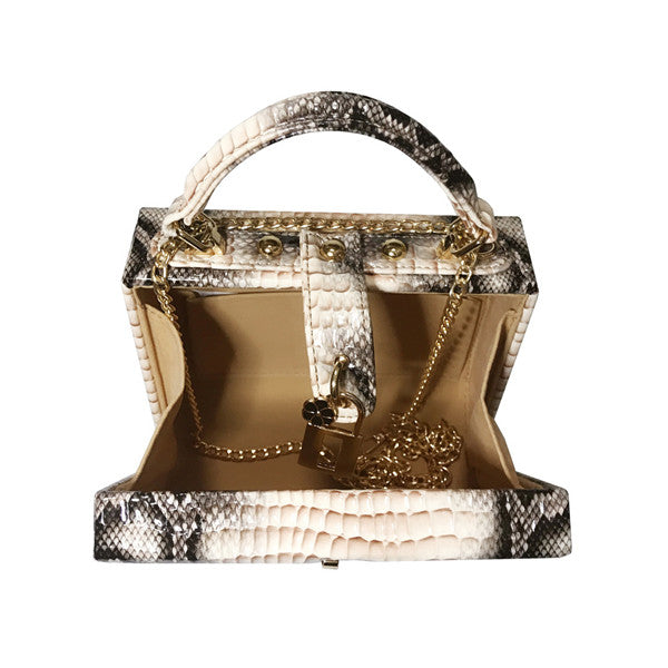 Gold handbag with snake skin pattern on a white background