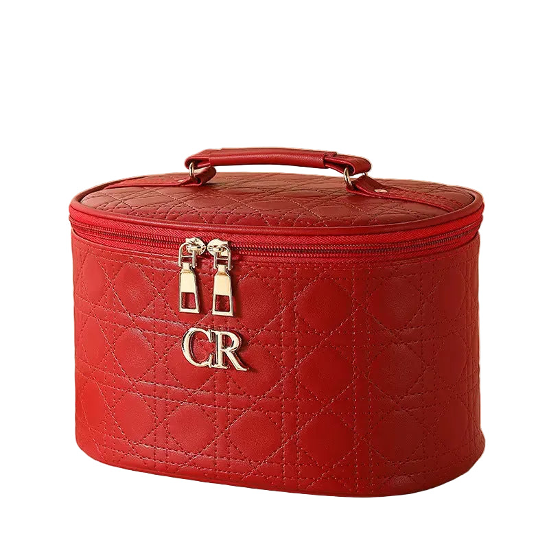 Red quilted cosmetic bag with 'CR' logo on a white background