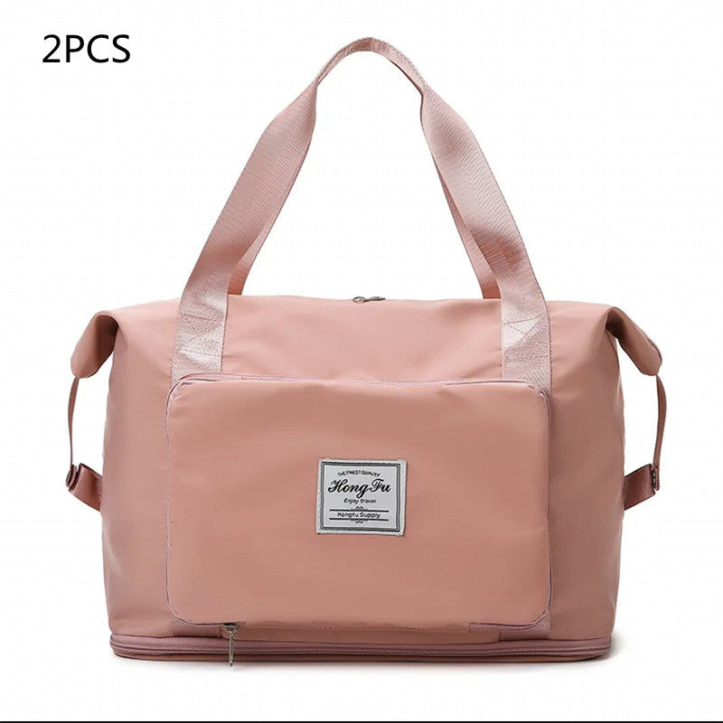 Pink travel bag with a visible brand label on a white background