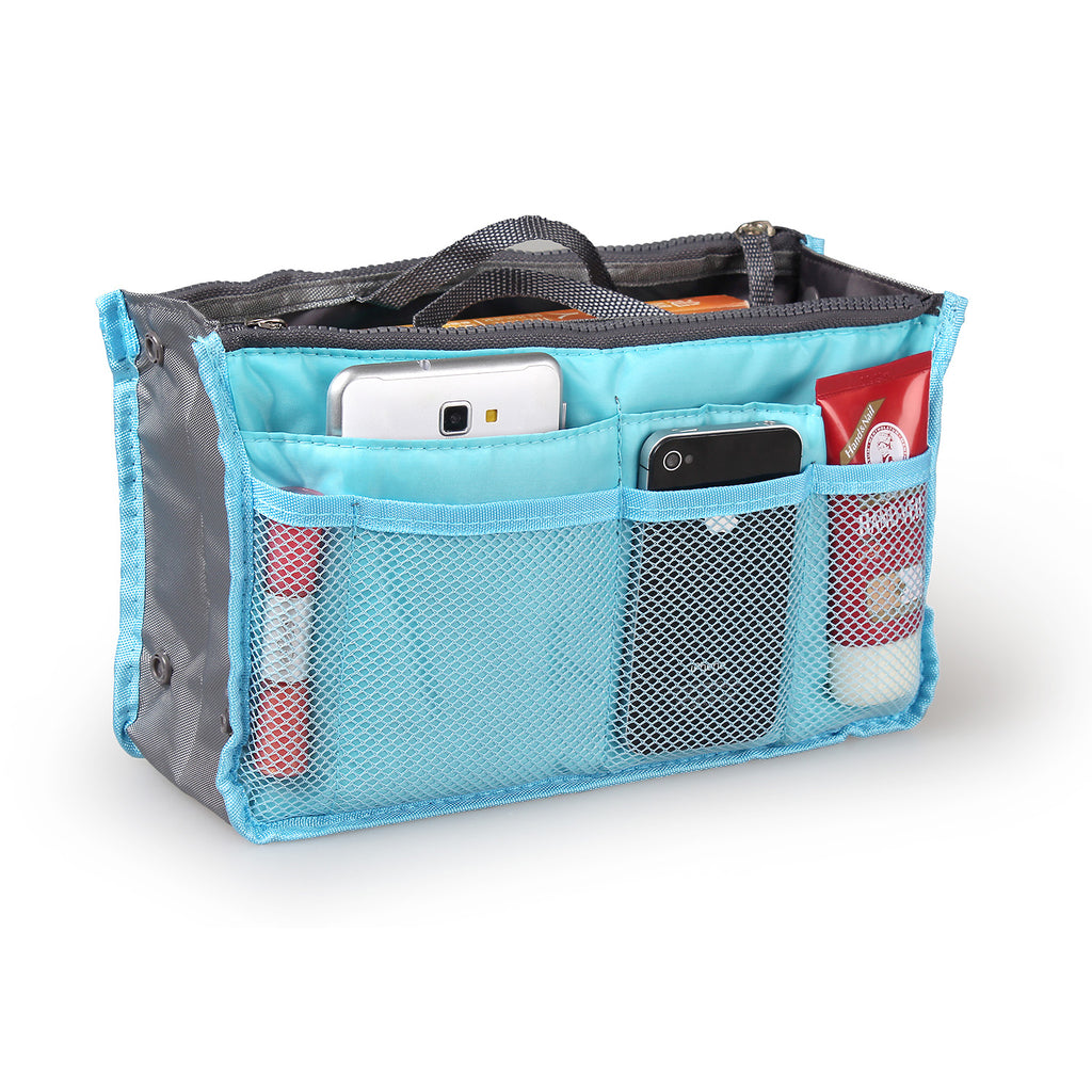 Blue organizer bag with compartments holding a phone, bottle, and other items on a white background