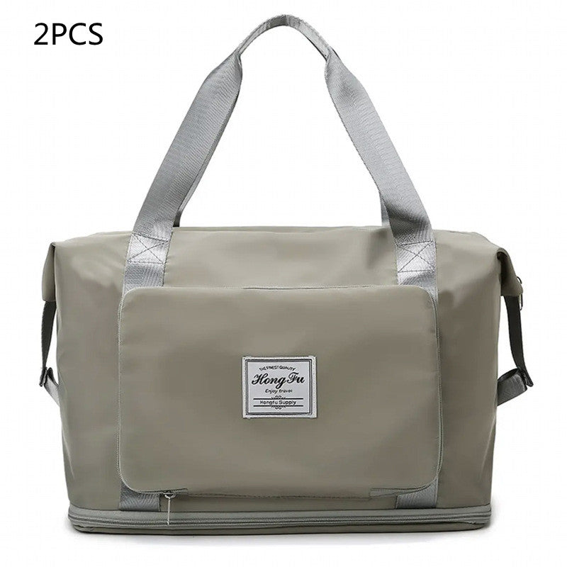 Gray duffel bag with a visible brand label on a white background